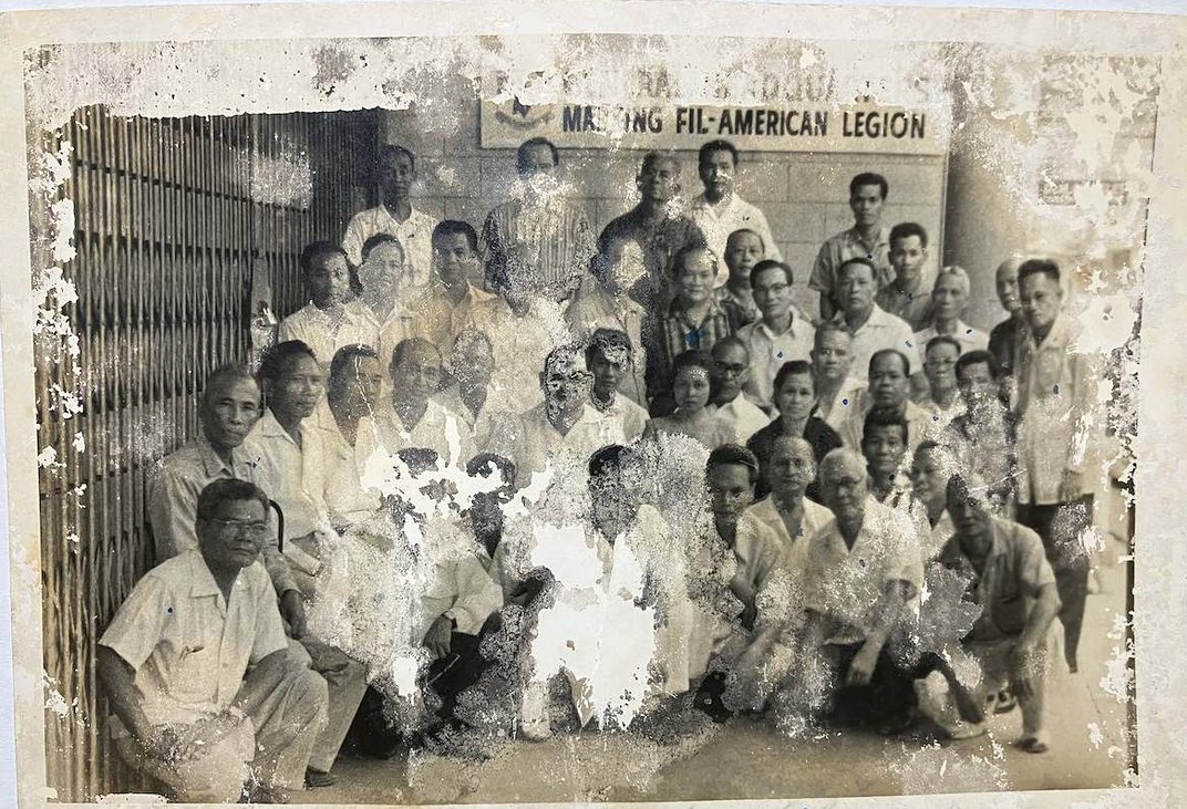 Antonio's badly damaged group photograph before restoration